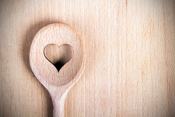 istock Heart hole spoon on the wooden pastry board 533628557