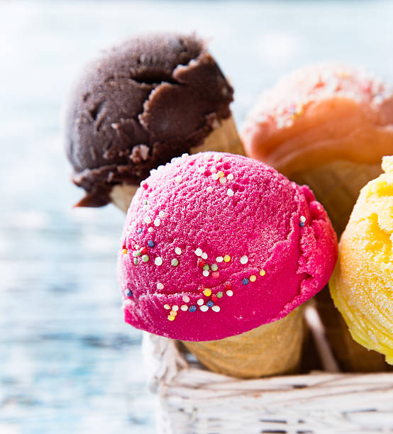 istock Ice cream scoops on wooden table. 533629241