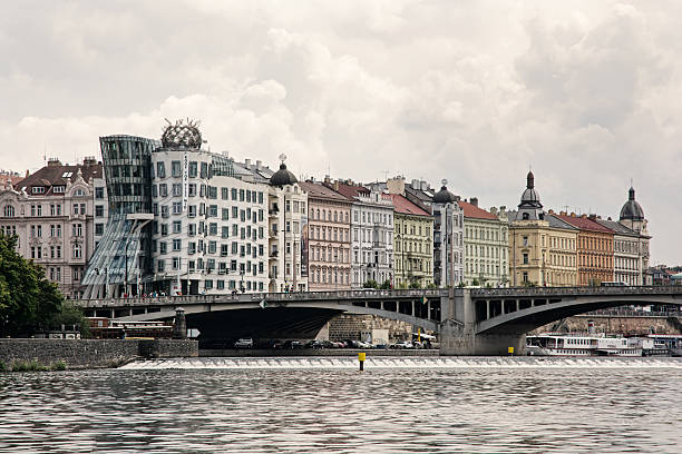 Dancing house and Jiraskuv bridge in Prague city, Czech republic, Europe.