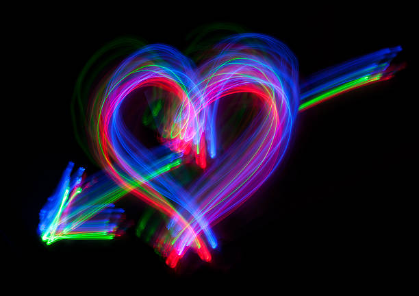 istock Lighting Heart With Arrow On Black 533629763
