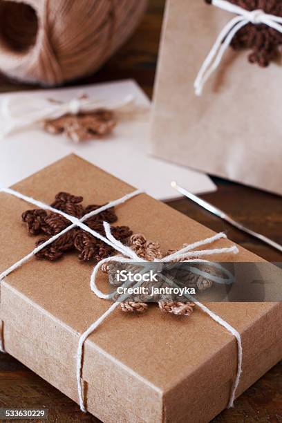Brown Crochet Snowflakes For Christmas Decoration Of Gift Box P Stock Photo - Download Image Now