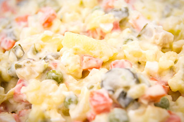 Traditional european potato salad with mixed vegetables.