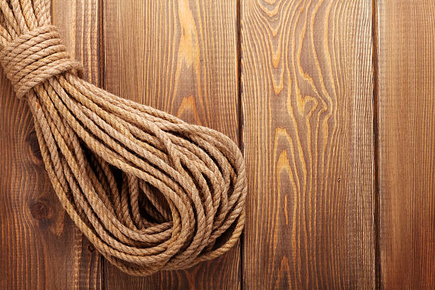istock Wooden background with marine rope 533632833