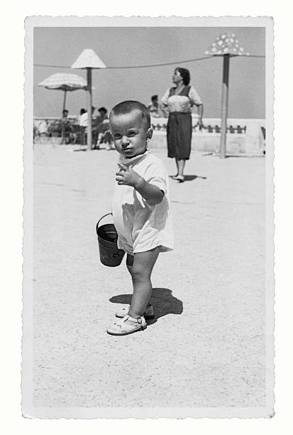 istock Mother and son at the beach in 1950 533633159