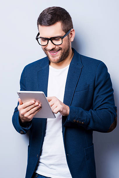 istock Examining his brand new tablet. 533647385