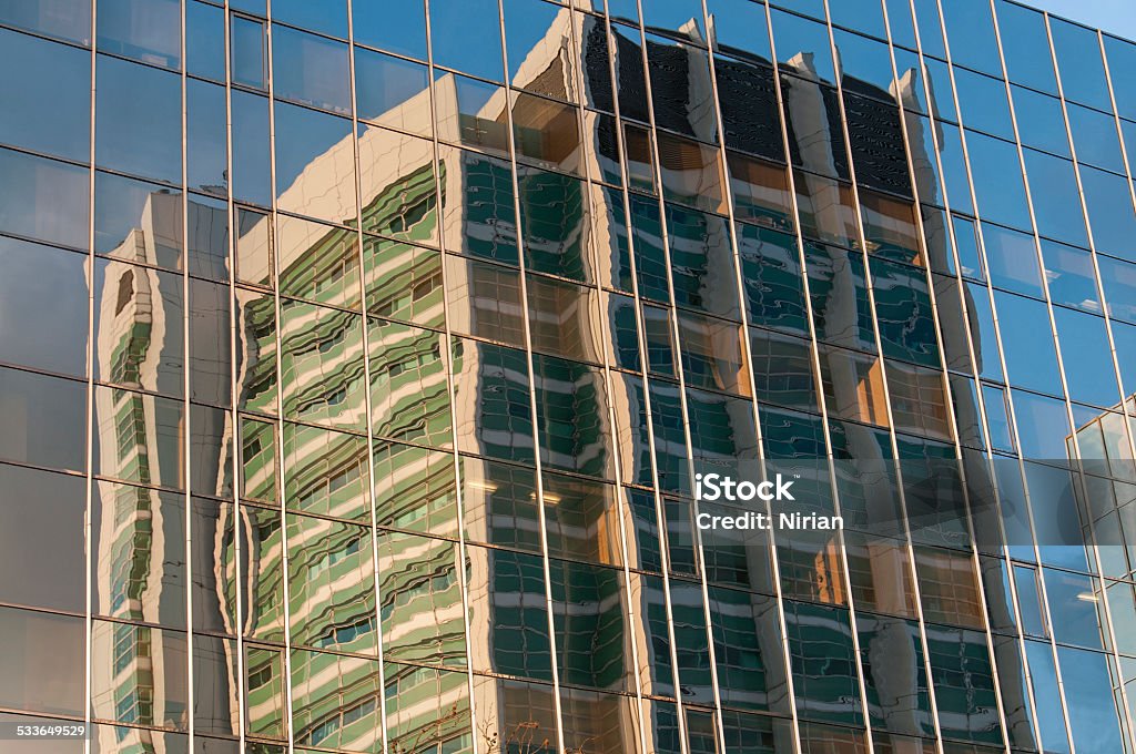 Mirror building Reflection of office building  in the windows of another office building. 2015 Stock Photo