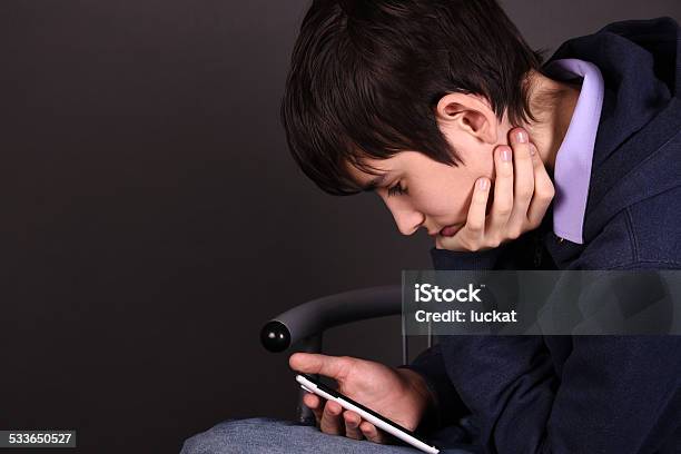 Boy With A Smartphone Stock Photo - Download Image Now - 2015, Boys, Brand Name Video Game