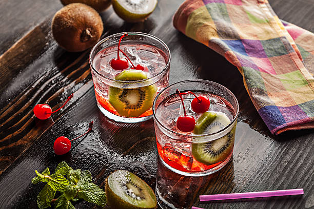 istock Cold summer cocktail drink with cherry and kiwi 533650965