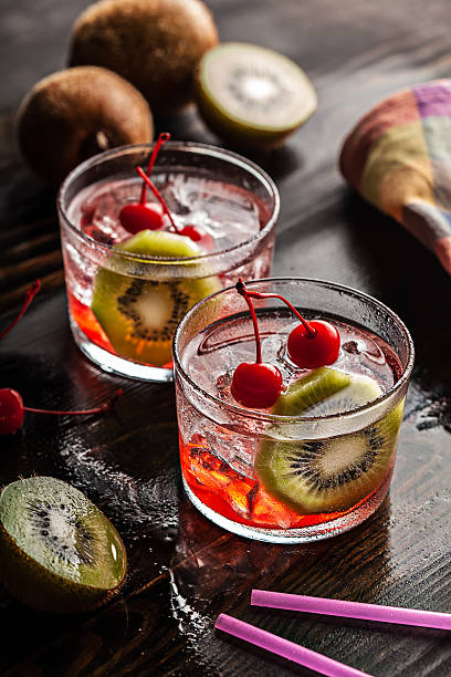 istock Cold summer cocktail drink with cherry and kiwi 533650975