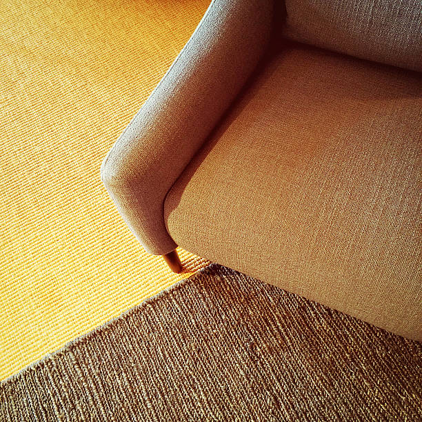 istock Textile armchair and knitted carpet in warm colors 533668721