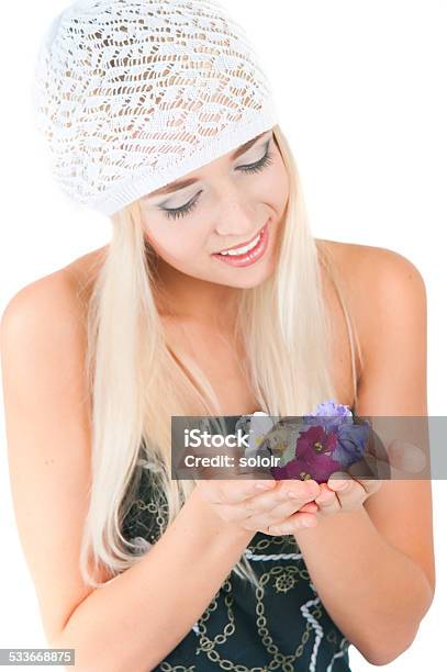 Blond Girl With A Bouquet Of Violets Stock Photo - Download Image Now - 18-19 Years, 20-24 Years, 2015