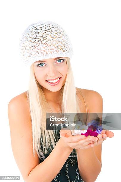 Blond Girl With A Bouquet Of Violets Stock Photo - Download Image Now - 18-19 Years, May, 20-24 Years