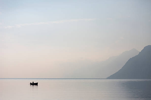 istock Lone Boat in the Lake Garda 533668935