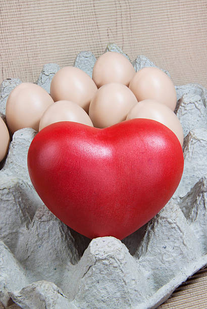 istock Heart and eggs on paper pattern wood 533669217
