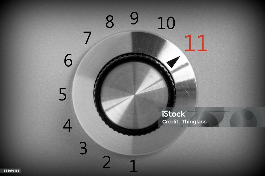 Full Power Black and white image of a volume or power control switch on a metal background that goes all the way up to the number eleven. Number 11 Stock Photo