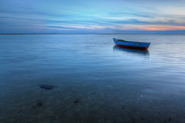 istock Old abandoned boat on the sea in the background. 533695449