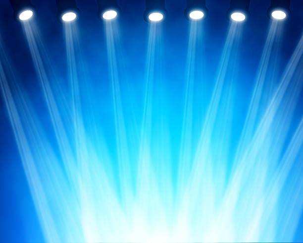 istock illustration of blue stage spotlights 533695797
