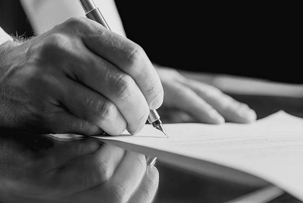 istock Businessman signing a business document 533696005