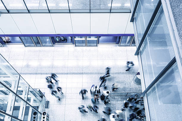 istock busy people walking by modern building 533697008