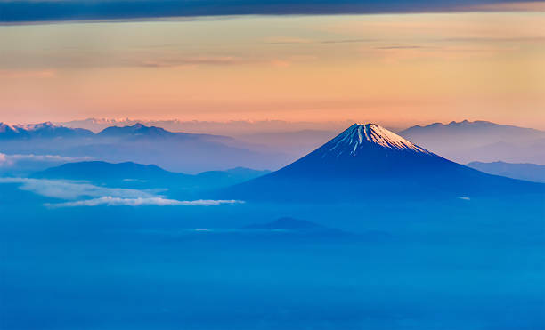 Aerial view of Mount Fuji in the morning Aerial view of Mount Fuji in the morning - Japan cone shape photos stock pictures, royalty-free photos & images