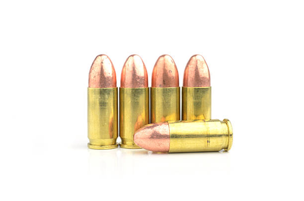 istock 9mm bullet for a gun isolated on white background. 533697621