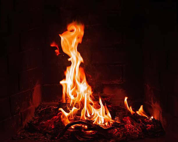 istock Fireplace burning. Warm burning and glowing fire in fireplace. 533697977