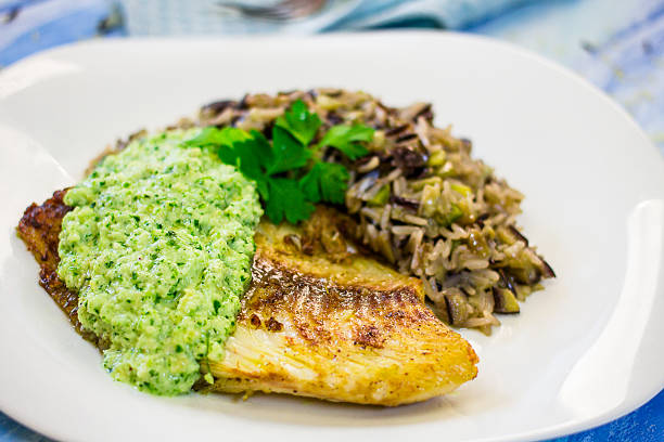 istock White fish with pesto sauce 533699540