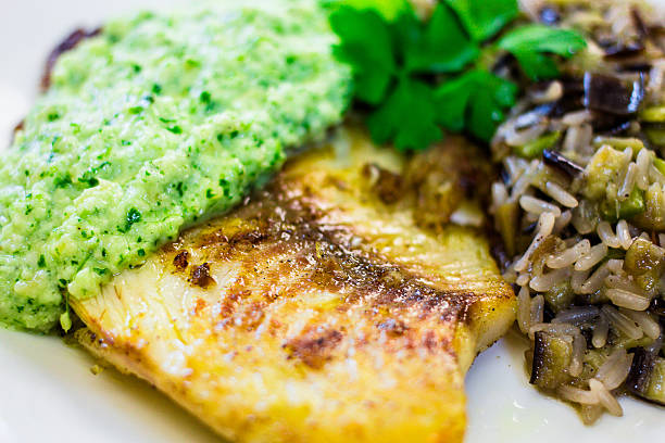 istock White fish with pesto sauce 533699948