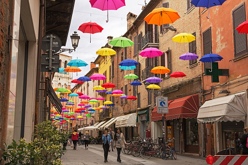 Ferrara, Italy -  May 02, 2016: Umbrella sky in Ferrara, Italy.  The installation is set up in Mazzini Street and is visible from town square inviting people to follow in that direction. The aim of the installation is to highlight commecial activities in the city centre.