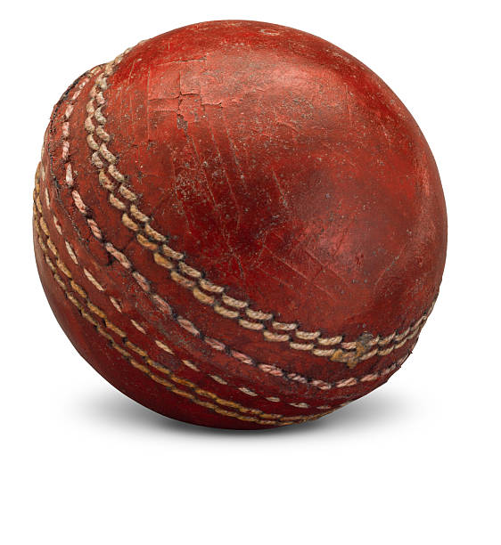 istock Old worn cricket ball on white 533702866