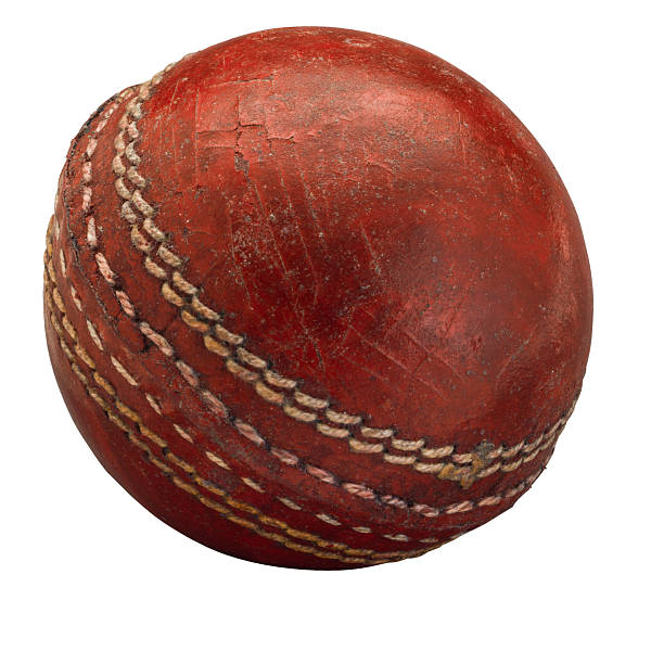 istock Old worn cricket ball on white 533702992