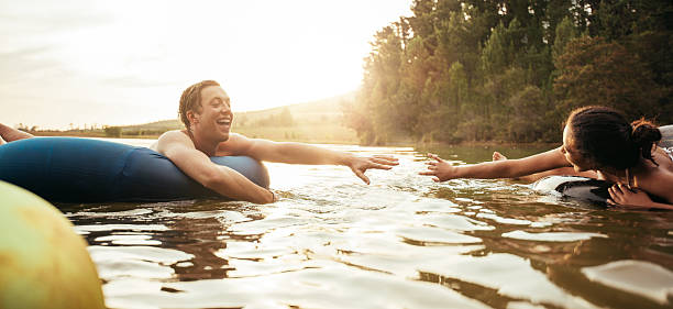 istock Loving young couple having fun in the lake 533703136