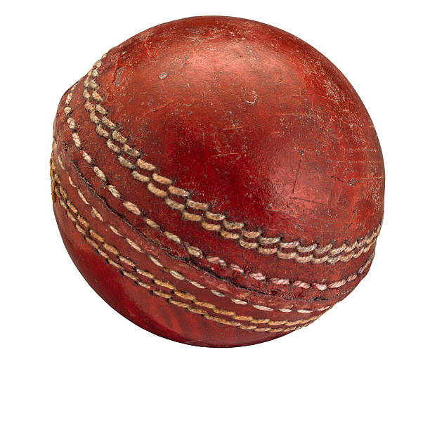 istock Old worn cricket ball on white 533703518