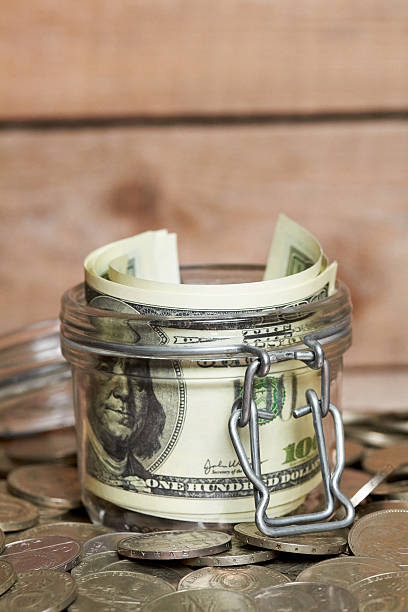 istock Glass jar with dollar bills 533703736