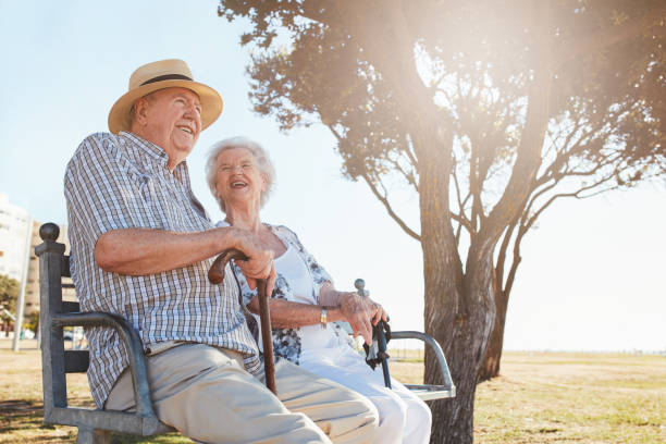 istock Relaxed senior couple sitting on a park bench 533704094