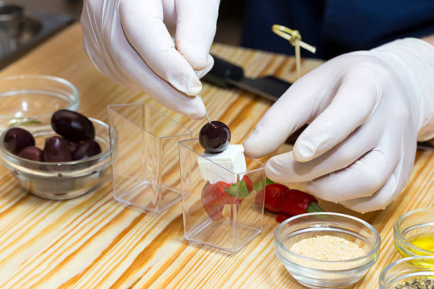 istock cook prepares canapes in the kitchen 533704324