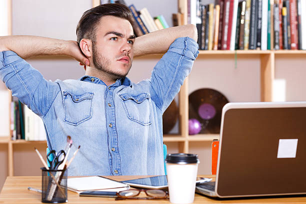 istock Attractive man sitting at the table and thinking 533706662