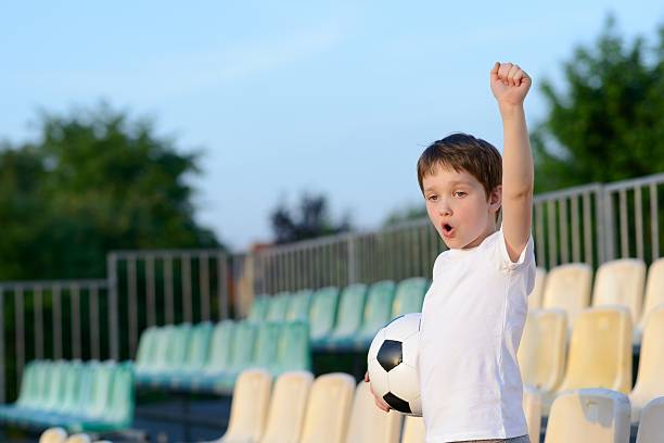 istock Little boy - football team fan - 533711562