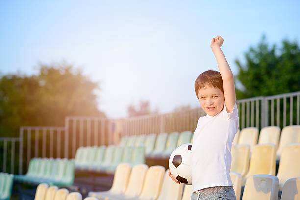 istock Little boy - football team fan - 533711714