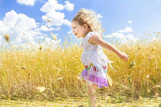 istock Profile of active running girl at sunny field background 533711730