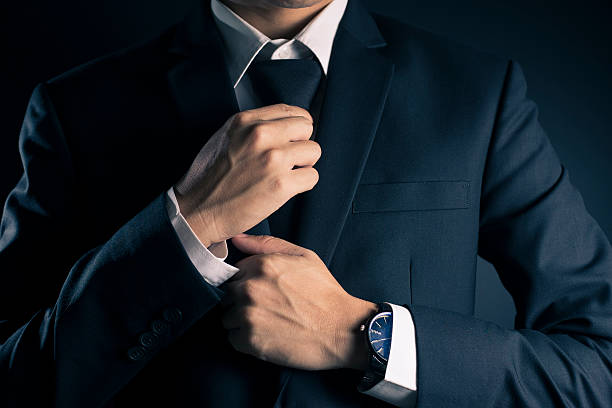 istock Businessman Adjust Necktie his Suit 533712912