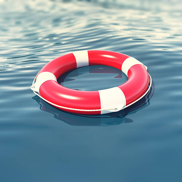 istock Red lifebuoy in blue sea with depth of field effect 533713006