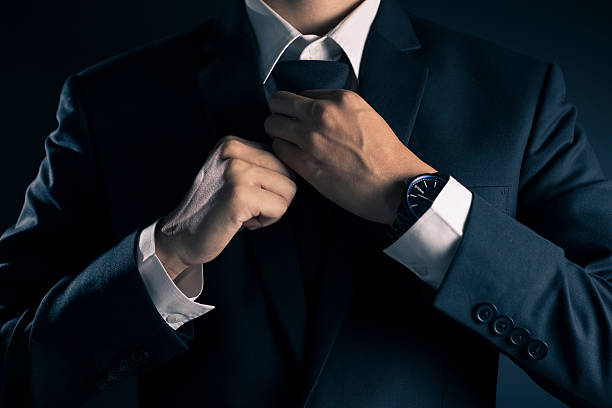 istock Businessman Adjust Necktie his Suit 533713070