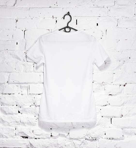 istock brick whitewashed wall with white t- shirt on hanger 533713080
