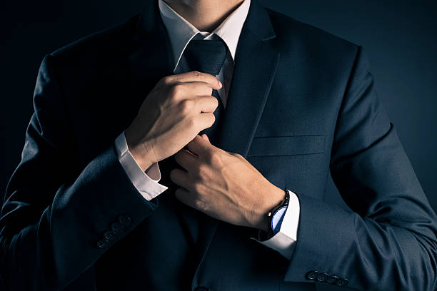 istock Businessman Adjust Necktie his Suit 533713162