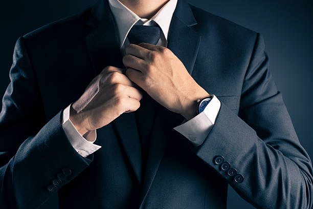 istock Businessman Adjust Necktie his Suit 533713232