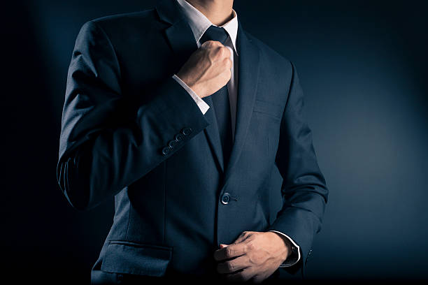 istock Businessman Adjust Necktie his Suit 533713586