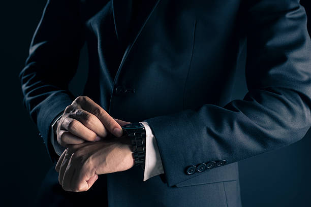 istock Businessman checking time from watch 533713820