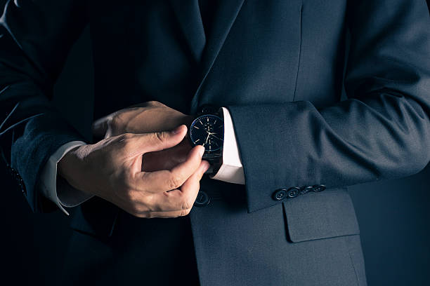 istock Businessman checking time from watch 533715138