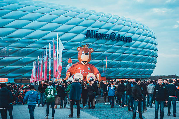 People at entrance of Allianz Arena stock photo